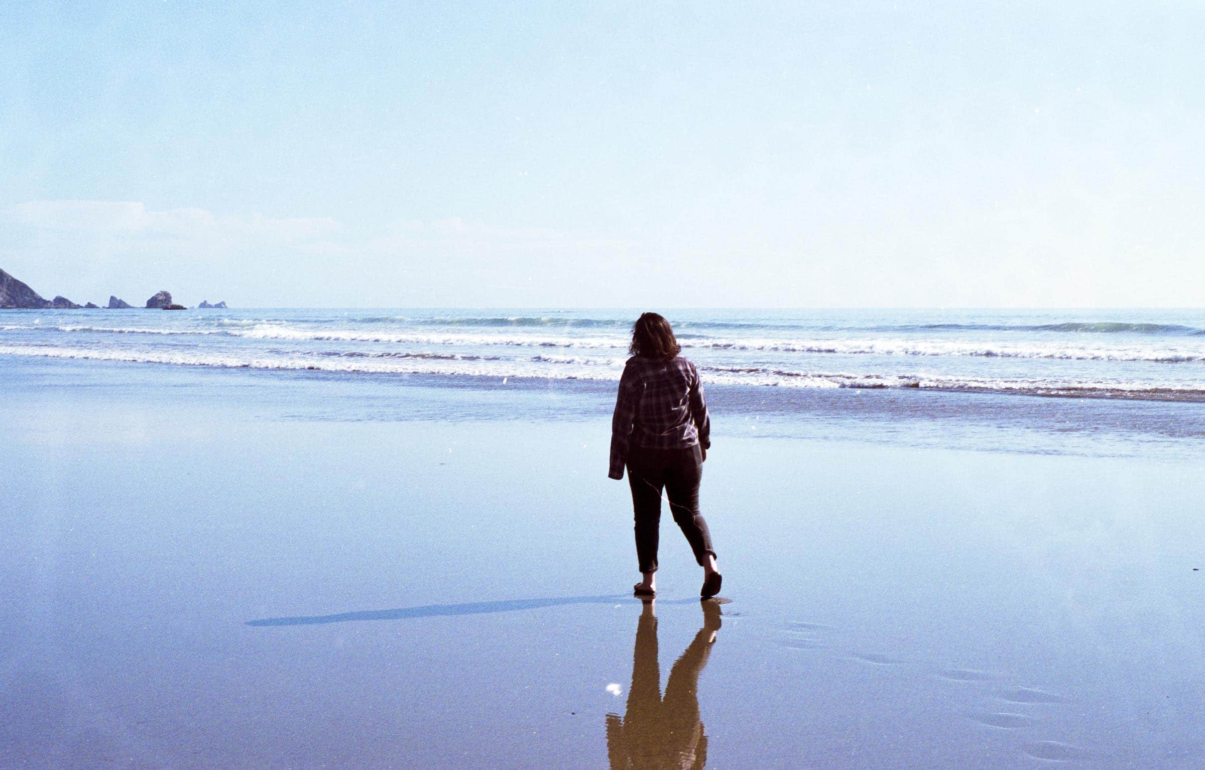 Maggie walking along the coast in Crescent City CA