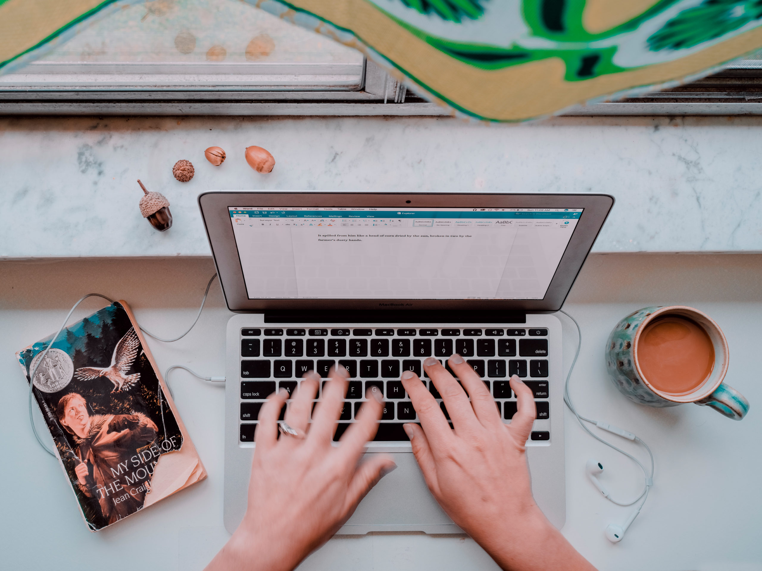 A writer working on a story on her MacBook pro