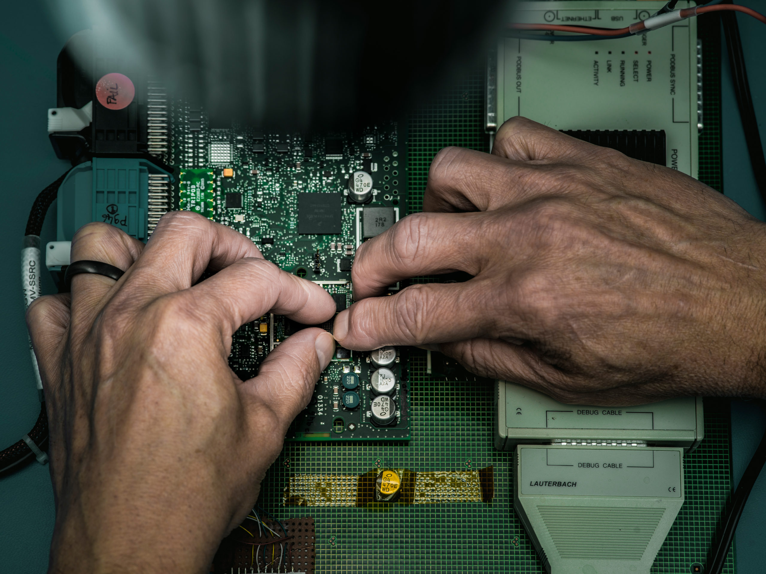 An engineer works on reparing a computer chip