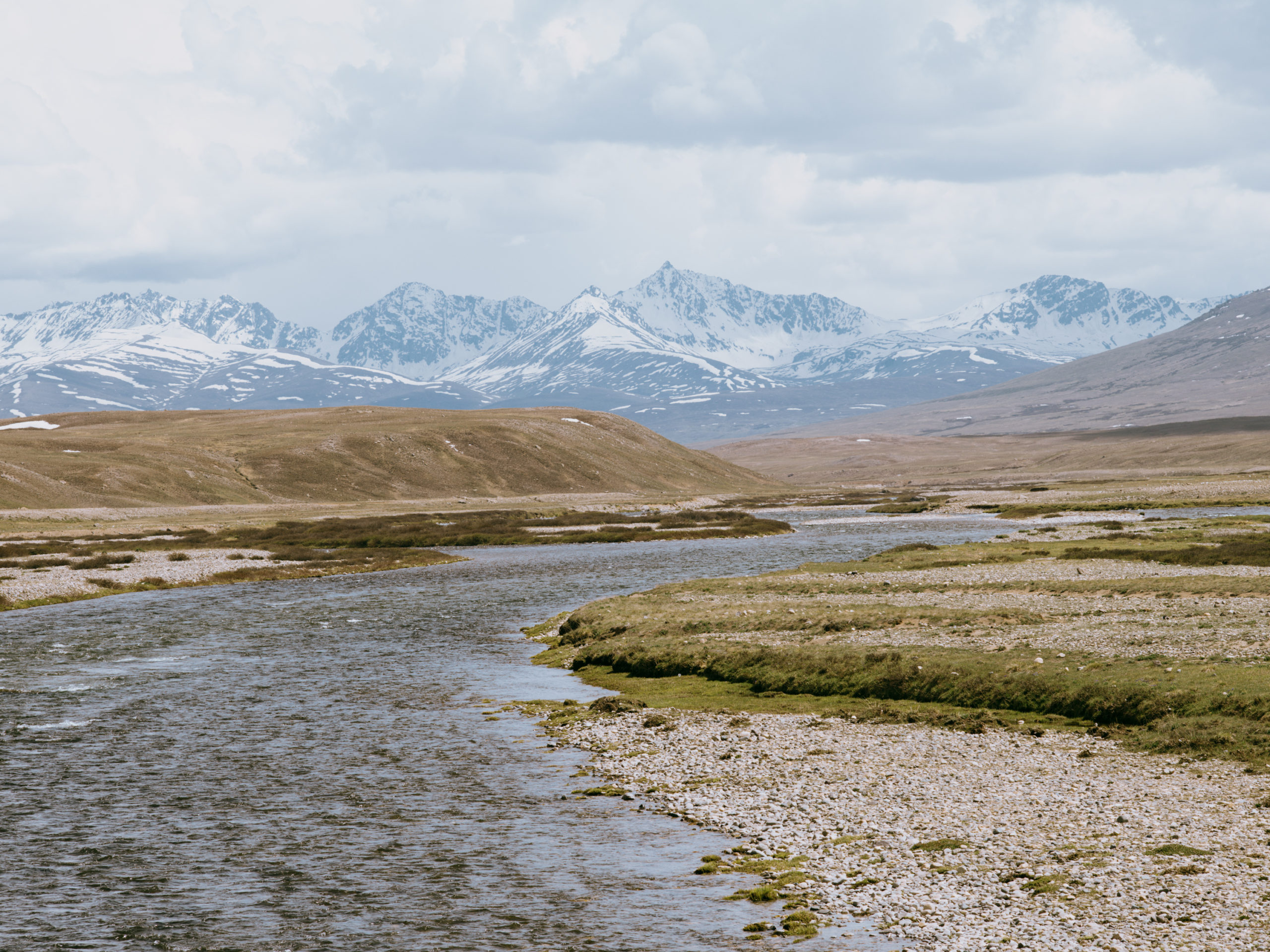 View of the river and mountains from a bridge