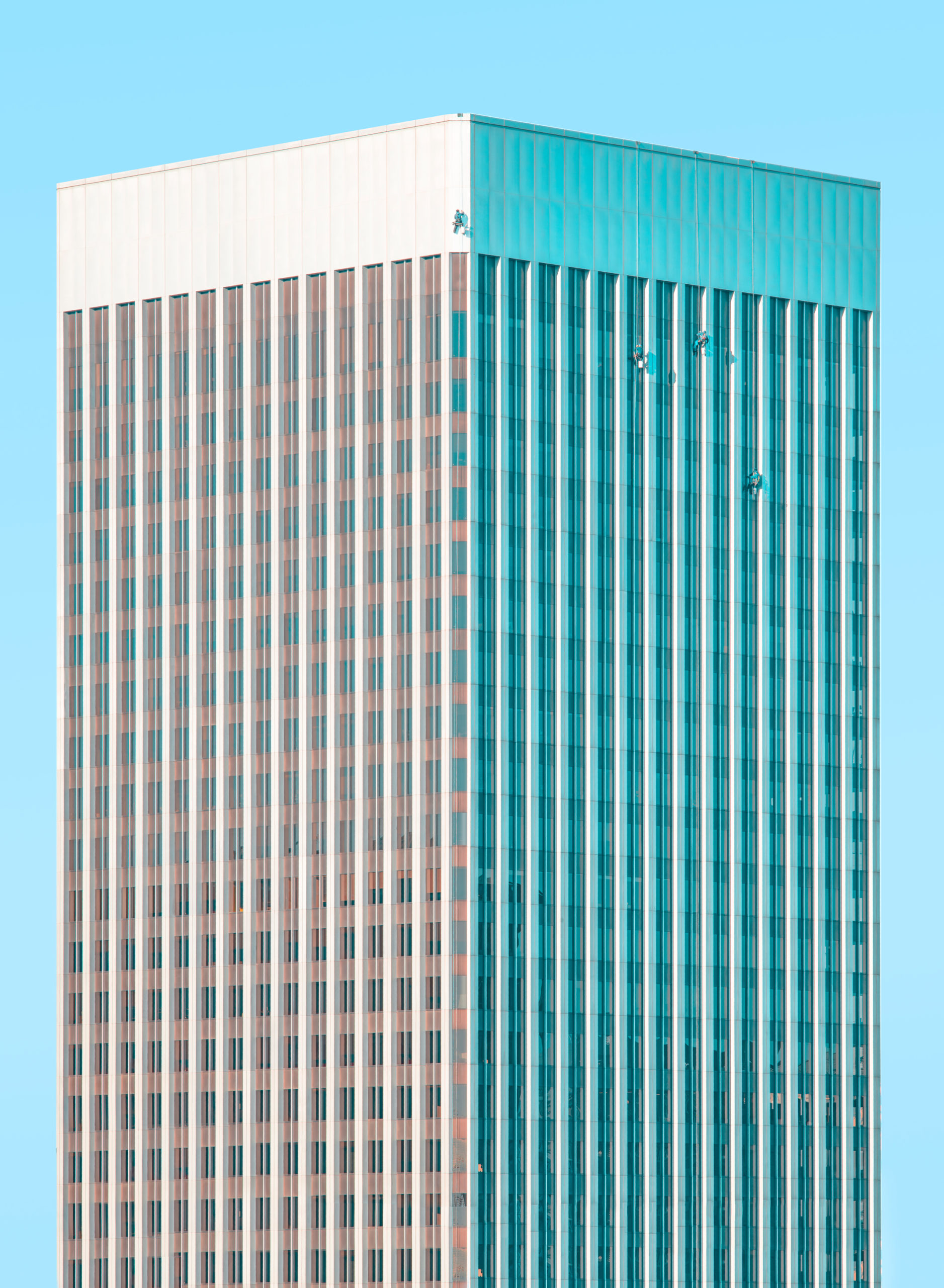 The Rainier Tower photographed against a clear blue sky in Seattle WA